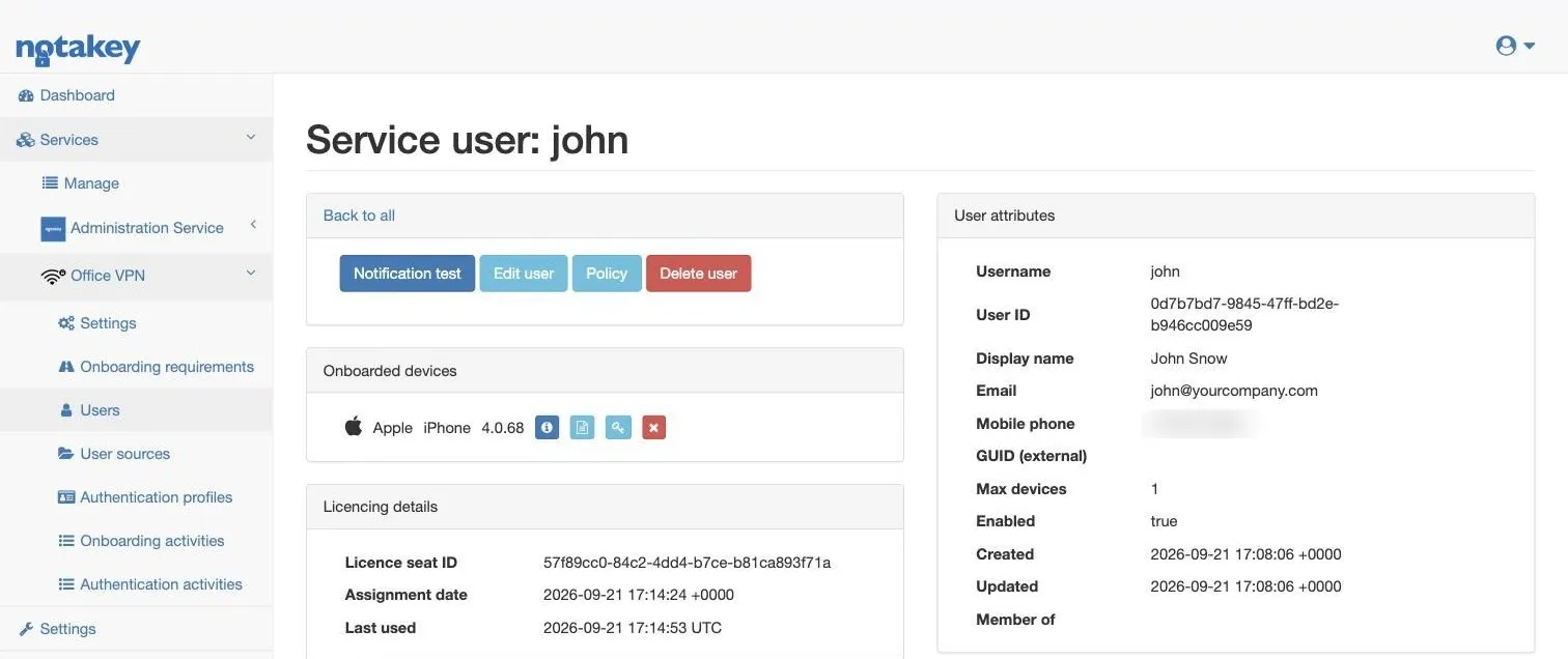 The user page for john: a Notification test button, the onboarded iPhone under Onboarded devices, and the user’s attributes (phone number blurred).